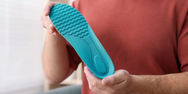 Illustration showing improvements before and after custom orthotics for proper support and posture.